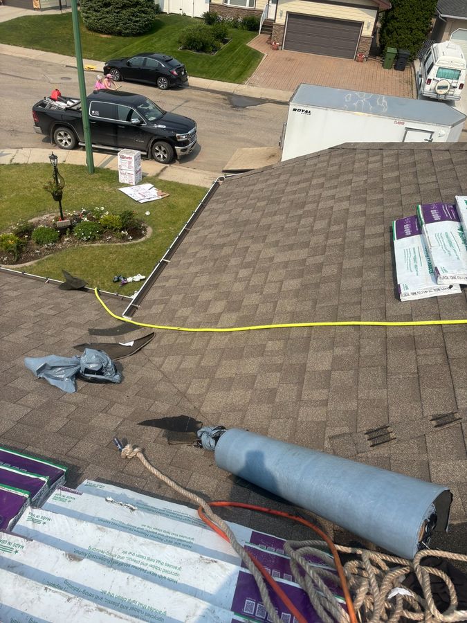 Active roofing job site with IKO Cambridge architectural shingles