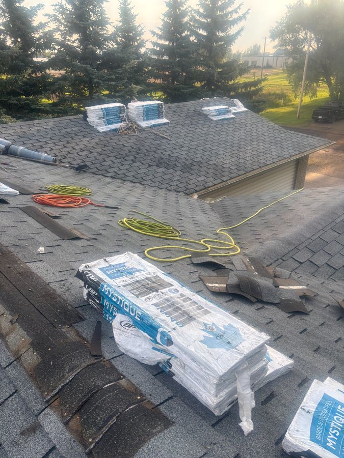 BP Mystique shingle bundles staged at job site ready for installation