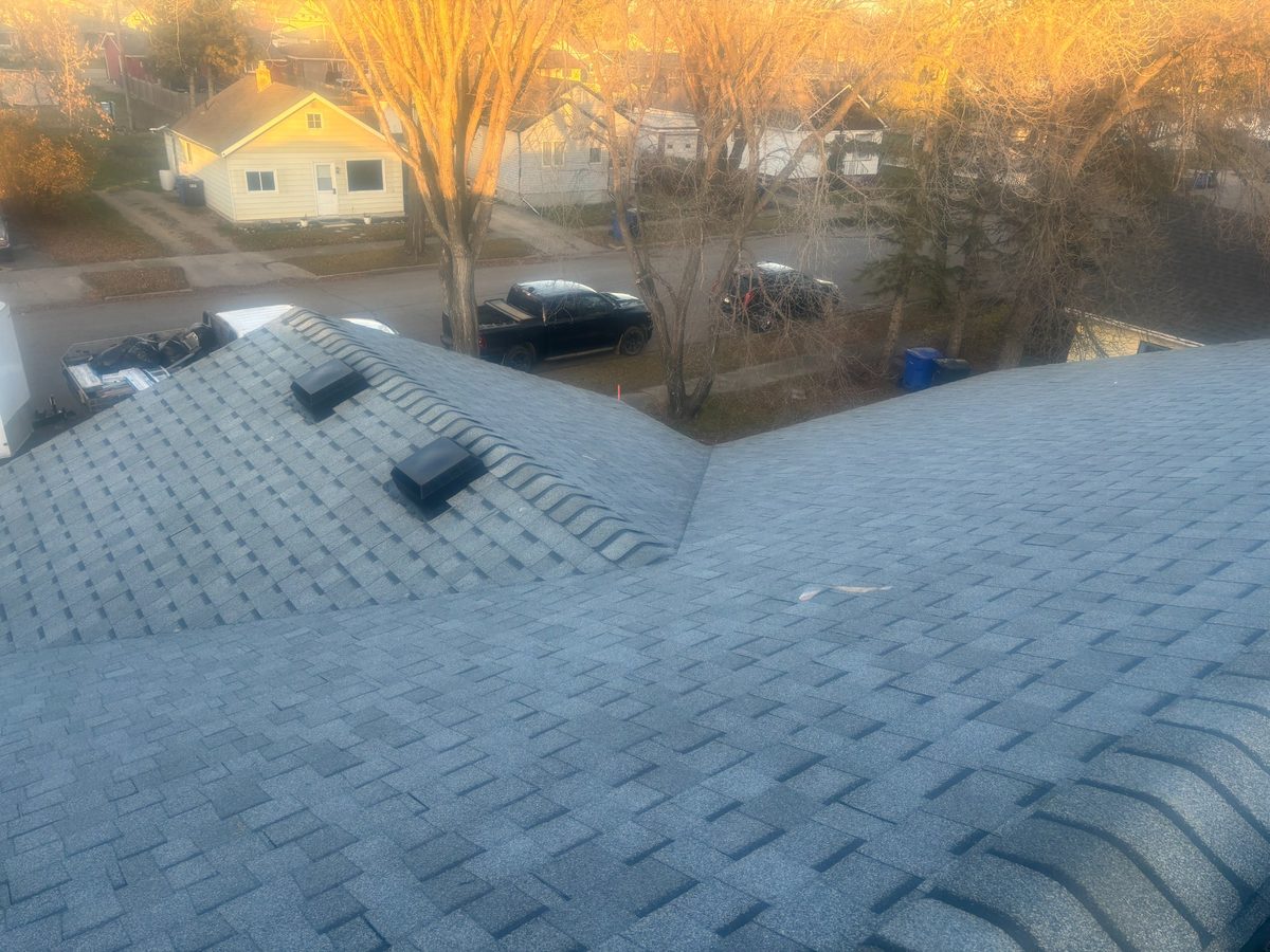 Completed roof replacement at golden hour in Yorkton