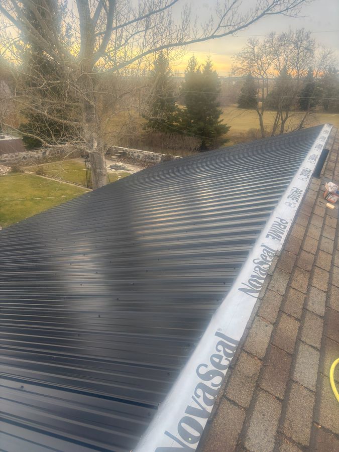 NovaSeal Prime transition between old shingles and new metal roof