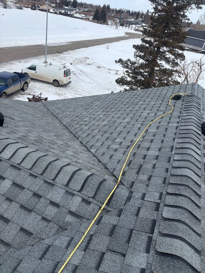 Completed winter roof replacement in snowy neighbourhood