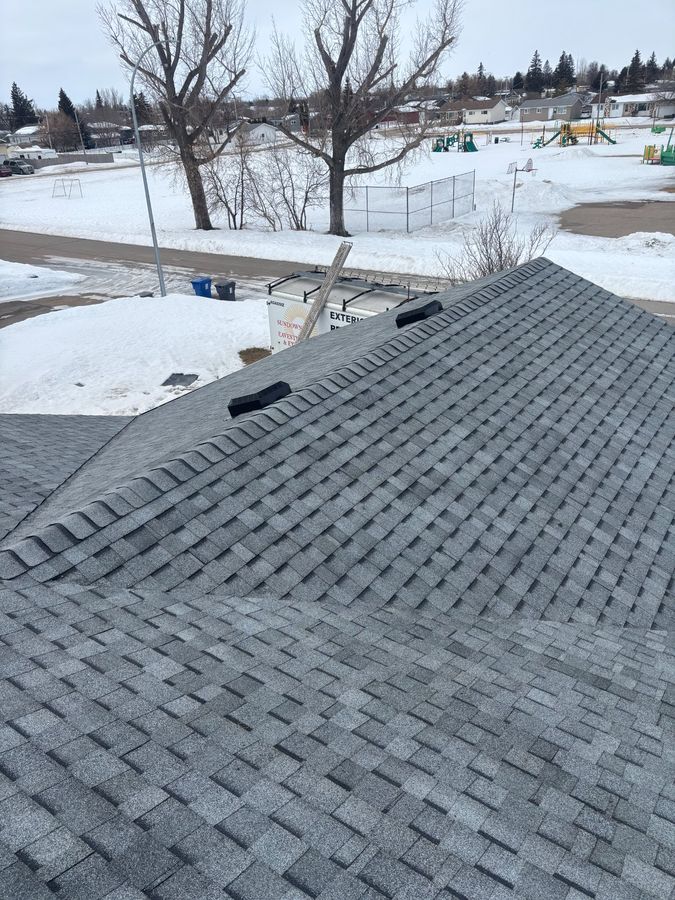 Winter complex hip and valley roof installation